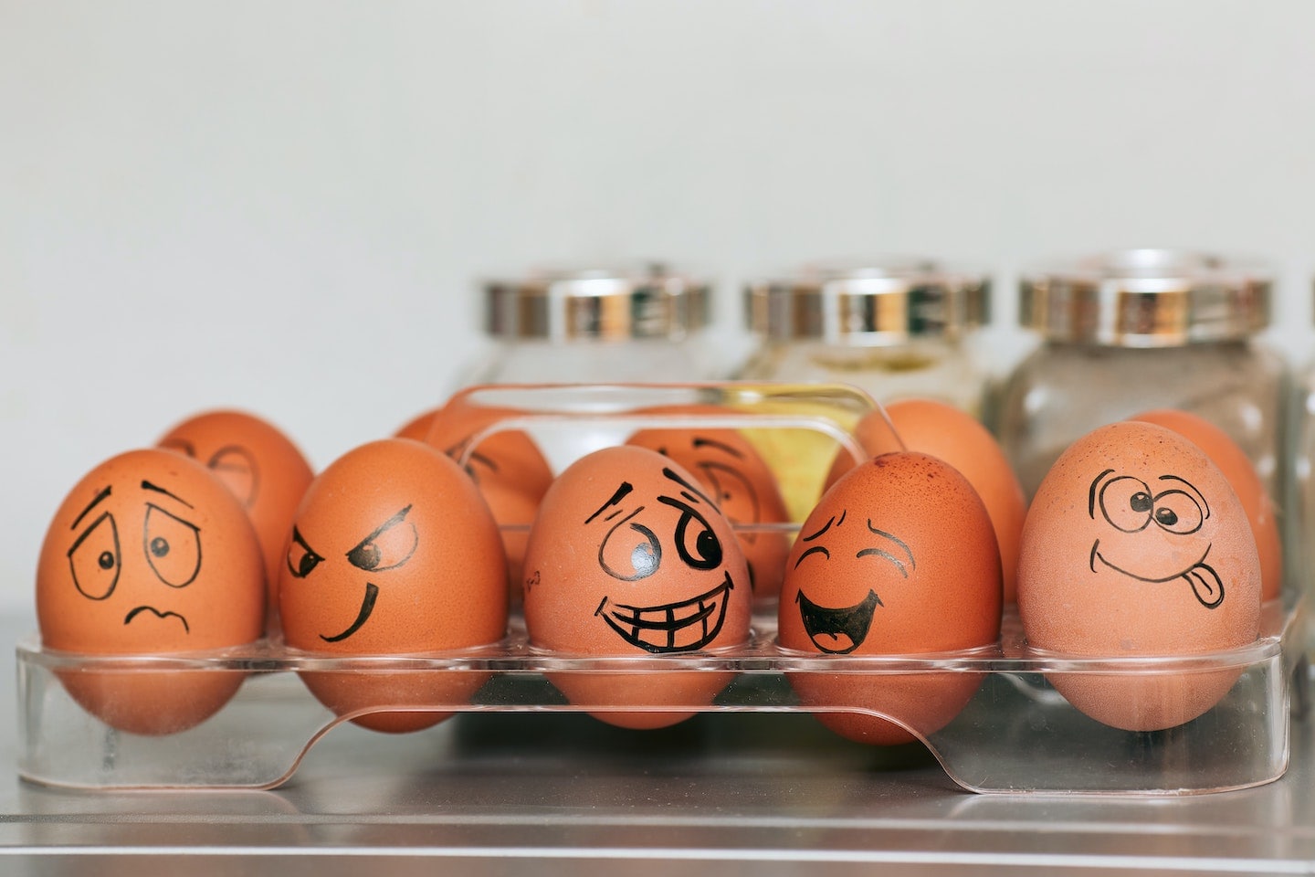 Eggs with faces drawn on them to depict different emotions
