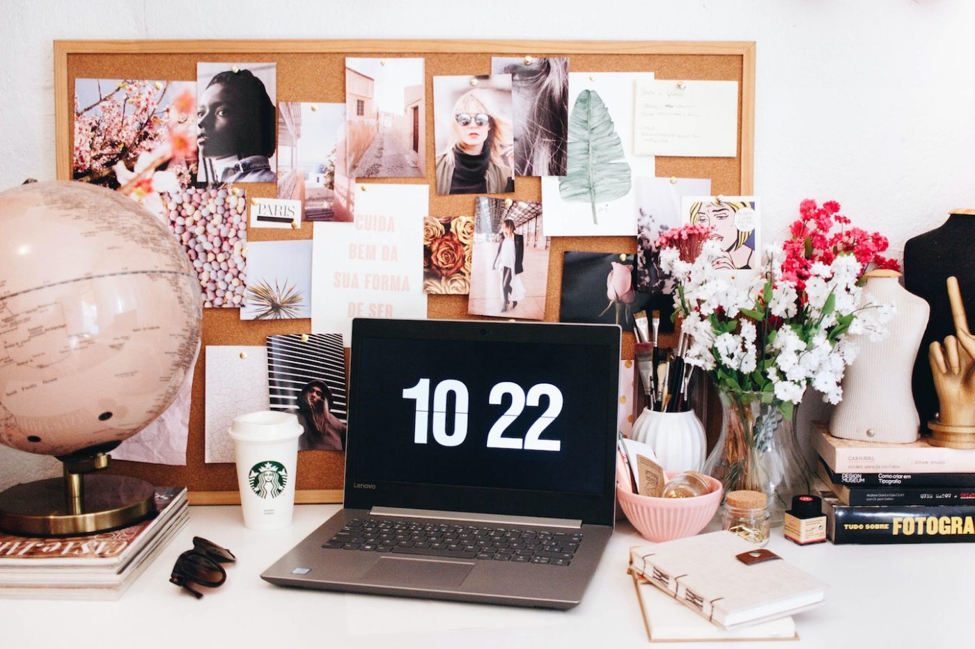 laptop open in front of fashion styled bulletin boards